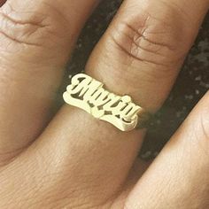 This LEE103 name ring is a classic but timeless jewelry with script letters and lovely heart tail. Personalize this custom ring with the name of your choice. Treat yourself or make it a gift for loved ones, birthdays, anniversaries, or celebrations. * Personalize with name up to 8 characters (only first letter is capitalized) * 10k Yellow or White Solid Gold (weighs about 2.0g to 2.4g) * 14k Yellow, White, or Rose Solid Gold (weighs about 2.1g to 2.6g) * Measures approx. 7.5mm from first initial Gold Rings With Names, Custom Name Ring, Name Rings Gold, Rings With Names, Gold Name Ring, Script Heart, Digital Wardrobe, Script Letters, Ring Inspo