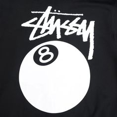 the back of a black shirt with white lettering and a eight ball on it's chest