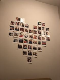 a heart made out of photos hanging on the wall