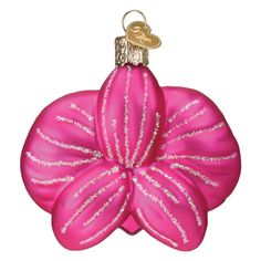 an ornament shaped like a flower with glitters on it's petals