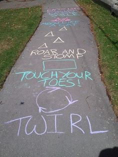 chalk writing on the sidewalk in front of a house that says, touhour toest turl