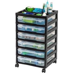 a black cart with five drawers and plastic containers on it's wheels, holding various items