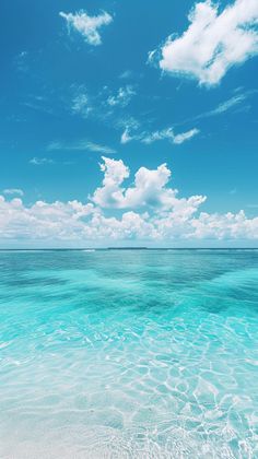 the water is very clear and blue with some clouds