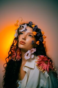 a woman with flowers in her hair