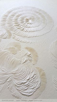 an intricately designed wallpaper with white paint