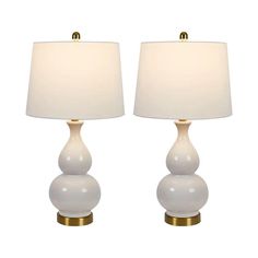 two white lamps sitting next to each other