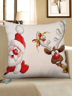 a christmas pillow with santa claus and reindeers on it