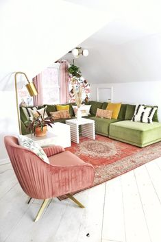 a living room filled with lots of furniture next to a large rug on top of a hard wood floor