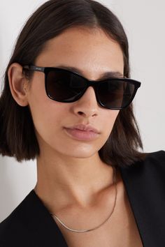 Saint Laurent Eyewear's sunglasses are minimally detailed with the brand's moniker stamped at the temples. Made in Italy, they have square frames made from glossy black acetate that almost match the UV-protective lenses. They'll suit everything from tailoring to your favorite jeans and a classic white T-shirt. Saint Laurent Eyewear, Workwear Women, Professional Workwear, Sunglasses Aesthetic, Wedding Sunglasses, Ysl Sunglasses, Celebrity Sunglasses, Saint Laurent Sunglasses, Classic Sunglasses