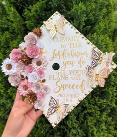 someone is holding up a graduation cap with flowers on it that says, commit the joy and happiness you have for your plans will sweet