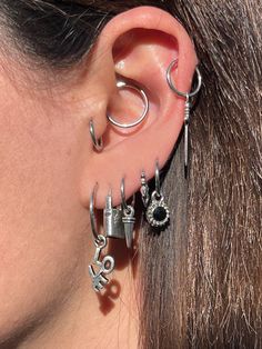 The Love Letter Hoops! ❤️ These hoops are 100% STAINLESS STEEL, Nickel Free, and Hypoallergenic! Won't Rust, Tarnish, or Turn Your Ears Green! Charms are 100% .925 Sterling Silver! Hoops are SEGMENT, seamlessly close. Hoops can either be bought in 10mm or 16mm!  Hoops thickness is 1.2 ( 16 gauge ) Example: 16MM ON THE FIRST LOBE AND 10MM IS ON THE 5TH LOBE! Er Piercings, Ear Piercings Inspiration Grunge, Ear Piercings Masc, Grunge Piercings, Piercing Inspo, Green Charms, Grunge Jewelry