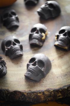 there are many black skulls on the table