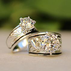 two diamond rings sitting on top of each other