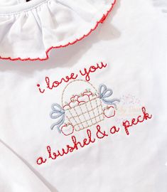 i love you a bushel and a peck embroidered on a baby's shirt