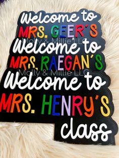 two magnets with the words welcome to mrs and mr henry's class on them