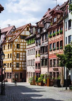 an old european street lined with colorful buildings