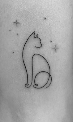 a black and white photo of a cat tattoo