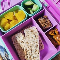 a purple tray filled with different types of food