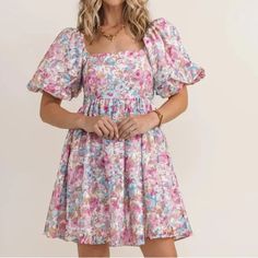 This Dress Is Perfect For Spring. It Has A Square Neck, Large Puffed Short Sleeves And Smocking Across The Back. The Floral Colors Are Pink, Rose, Blue, White And Tan In Muted Tones. So Soft And Pretty. It Is Fully Lined, Never Worn. Non Smoking Home. - Short Poofy Sleeve Mini Dress In A Bold Pink And Blue Floral Pattern - Stretchy Smocked Back For A Perfect Fit - Cinched At The Waist, Flaring Out Into A Twirl-Worthy Skirt - Perfect For A Girls' Night Out, Brunch, Or Date Night Brunch Dress Outfit, Pastel Floral Dress, Pink And Blue Dress, Tie Sleeve Dress, Dress Pastel, Brunch Dress, Draped Midi Dresses, Flowy Mini Dress, Swing Mini Dress