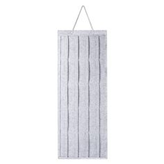 a white towel hanging on a wall with a hook in the middle and an empty hanger attached to it