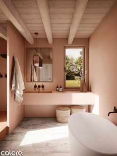 a bath room with a tub a sink and a large window in it's center