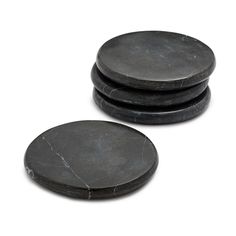 black marble coasters stacked on top of each other