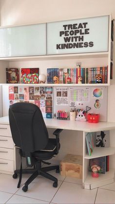 there is a desk with a chair in front of it and many books on the shelves