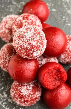 powdered sugar balls are piled on top of each other