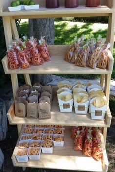 an outdoor food stand with various foods on it