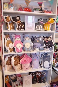 a shelf filled with lots of stuffed animals