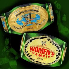 two women's wrestling belts with the words women's championship on them, against a green background