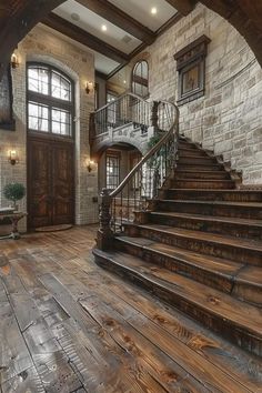 a large wooden staircase leading up to a stone building with arched windows and wood flooring