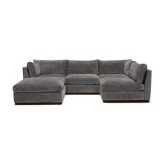 a gray sectional couch with two reclinings on the back and one end facing it
