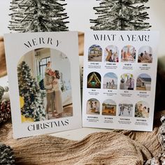 two christmas cards sitting on top of a table next to pine cones and fir trees