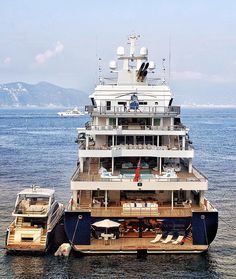 two boats are docked in the water near each other