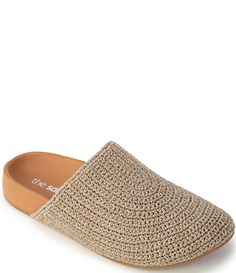 a pair of women's slippers with woven fabric and leather soles on the bottom