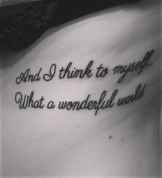 a woman's stomach with the words and i think to myself what a wonderful world written on it