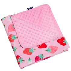 a pink blanket with strawberrys on it and polka dot print in the middle,