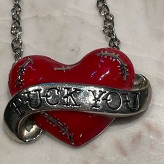 F*Ck Heart Necklace By Sourpuss. I Can’t Find This Anywhere. Never Worn. I’m Clearing Out My Closet And Listing A Lot Of Items. Please Contact Me With Any Questions. All Items Come From A Smoke Free Home. I Do Have Cats And I Try To Keep Them Out Of My Closet, But A Few Stray Hairs May Find Their Way In. Please Forgive. 2000s Accessories, 2000s Jewelry, Relationship Necklaces, Glow Jewelry, Y2k Accessories, Weird Jewelry, Y2k Jewelry, Fabric Accessories, Funky Jewelry