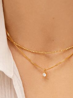 We're certain that the Victoria 18K Gold Necklace is one you'll never want to take off. A petite Cubic Zirconia stone sits on a downsized curb chain, combining both classic silhouette and trend-forward design in one. Better yet? This piece is crafted with 18K gold plated sterling silver.