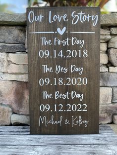 a wooden sign that says our love story