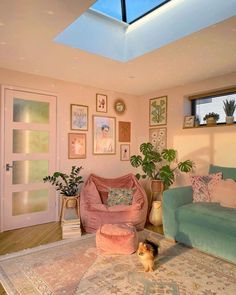 a living room filled with furniture and a skylight