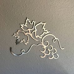 a metal horse head mounted to the side of a wall