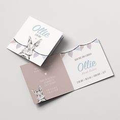 two business cards with an image of a rabbit on one side and the word ollie on the other