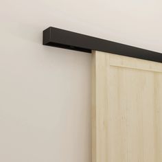 a close up of a sliding door with a black metal handle on it's side