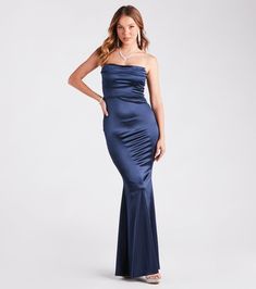 Make it an elegant entrance in the Priscilla formal satin mermaid long dress. She features a strapless sweetheart neckline, chic pleated detailing across the padded bust, a slim-fit bodice and a hip-hugging fit, and a floor-sweeping hem with a mermaid silhouette that will flaunt your gorgeous figure. The sleek lined satin-knit fabric showcases a luxe sheen. Complete the look with rhinestone statement earrings for your next gala or ball.Fit & FeaturesStrapless sweetheart necklinePleated, lightly padded bust, non-slip grip liningSlim-fit bodice, high waist seam, hip-hugging fitFloor-sweeping hem, mermaid silhouetteLined silky satin fabric, minimal stretchStrapless or sticky bra recommendedRuns true to size Satin Bridesmaid Dresses Long, Strapless Mermaid Dress, Mermaid Long Dress, Elegant Entrance, Satin Mermaid Dress, Sage Dress, Sticky Bra, Strapless Sweetheart Neckline, Long Prom Gowns