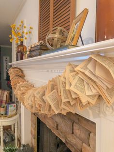 an open book is sitting on top of a mantle