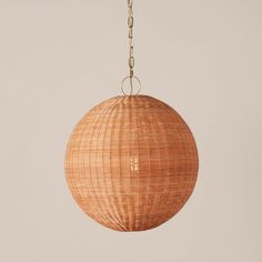 a rattan ball hanging from a chain