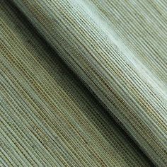 a close up view of a green and beige striped fabric, with small stripes on it