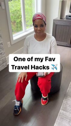 a woman sitting on top of a bean bag chair in front of a window with the words, one of my fav travel hacks